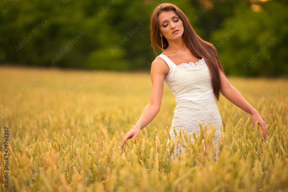 beautiful woman posing in yellow wheat field beautiful woman posing in yellow wheat field