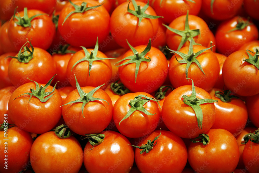 Group Of Fresh Tomatoes Background. Red Tomatoes On A Market Clo