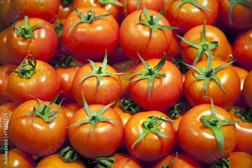 Group Of Fresh Tomatoes Background. Red Tomatoes On A Market Clo