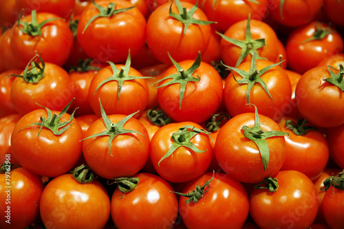 Group Of Fresh Tomatoes Background. Red Tomatoes On A Market Clo