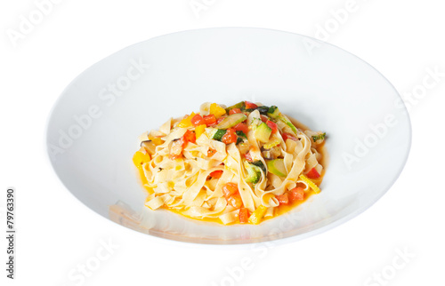 pasta with vegetables on a white plate