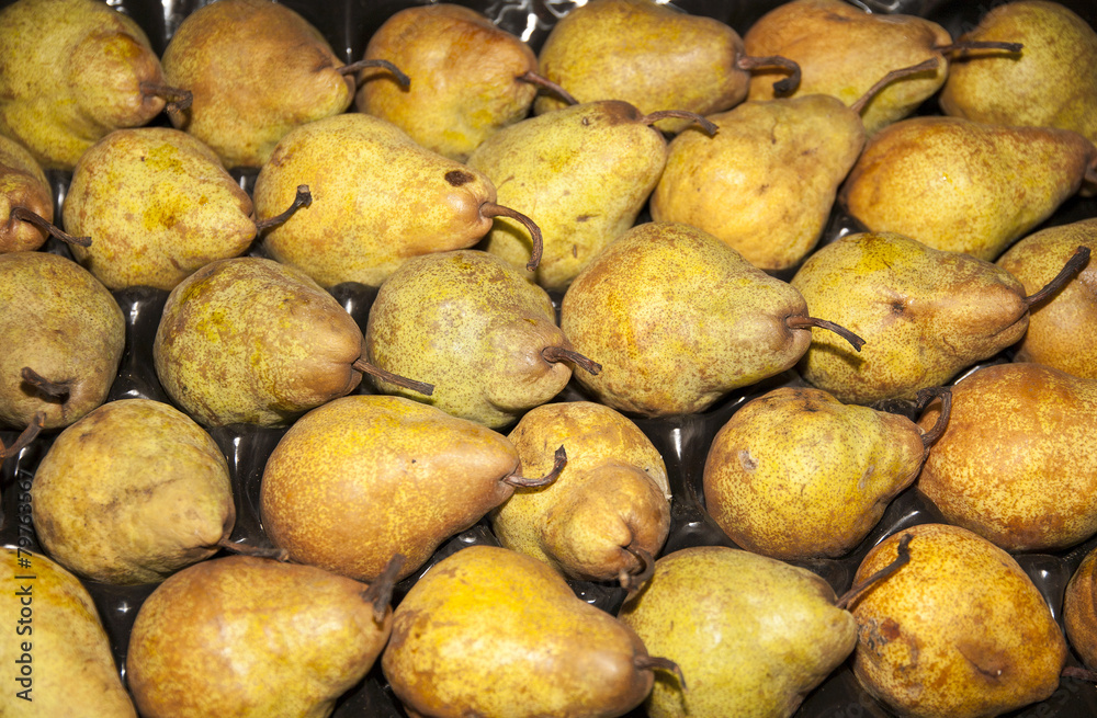 Freshly picked golden pears on retail market Freshly picked golden pears on retail market