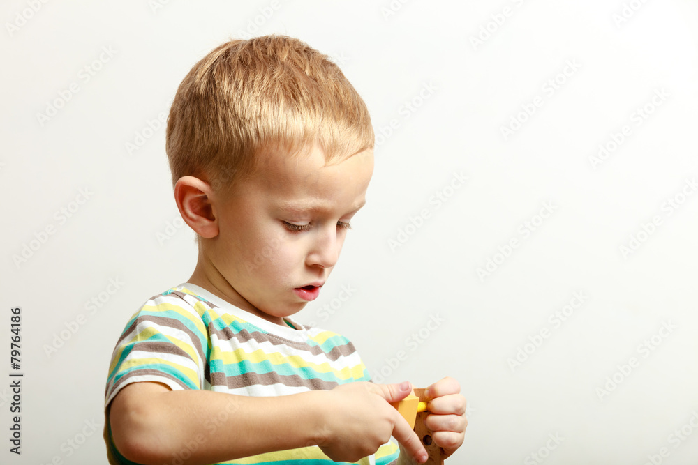 Little boy child playing with building blocks toys interior. Little boy child playing with building blocks toys interior.