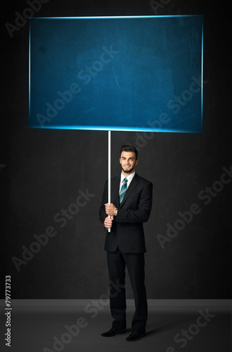 Businessman with blue board