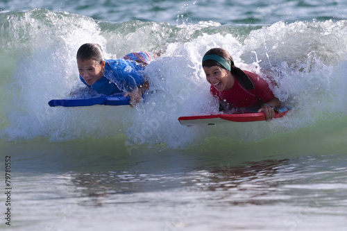 Two Girls doing surf in the beach