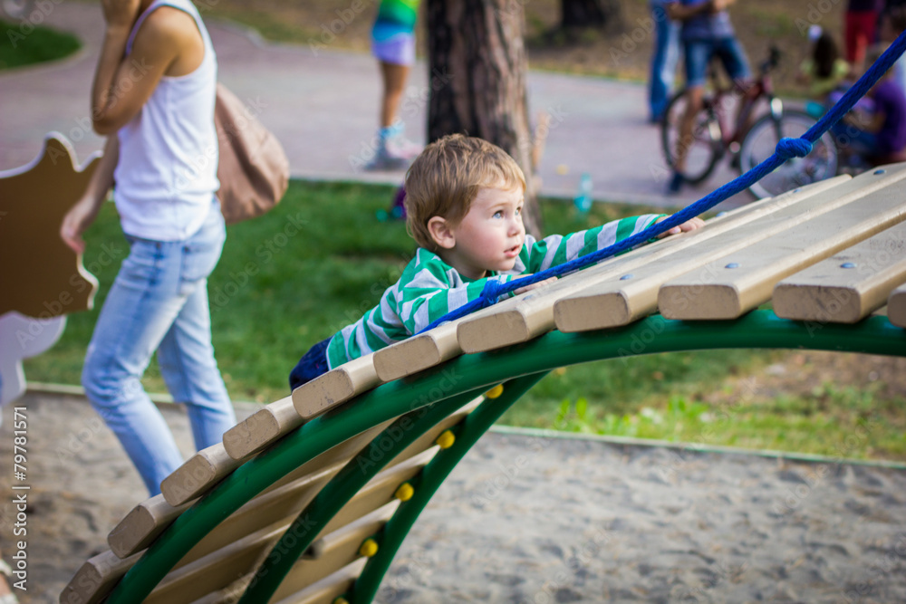 little boy playing on the Playground little boy playing on the Playground