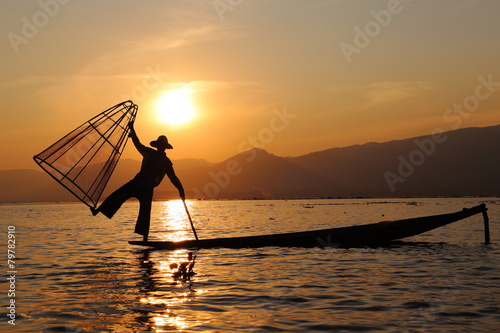 sunset and fisherman at inle lake photo