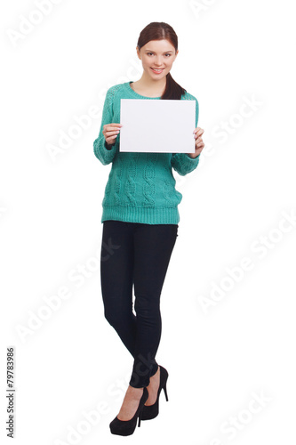 Cute yang woman holding a white banner and smiling