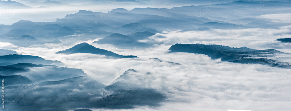 Misty mountains landscape in La Garrotxa, Catalonia Misty mountains landscape in La Garrotxa, Catalonia