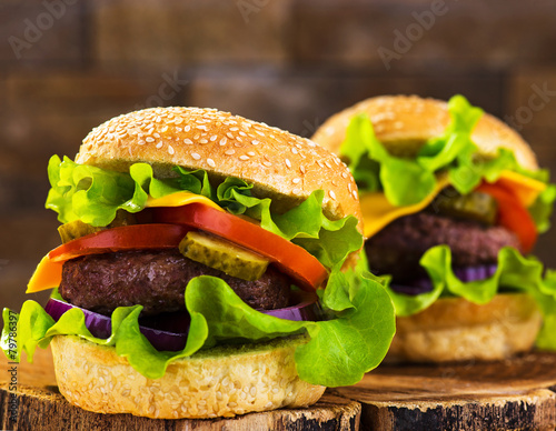 Big burger with beef cutlet and fresh vegetables photo