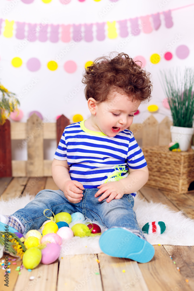 Fototapeta premium beautiful boy with Easter eggs