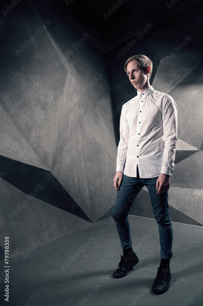 Obraz premium Stylish man looking away in white shirt, fashion male Full Lengt
