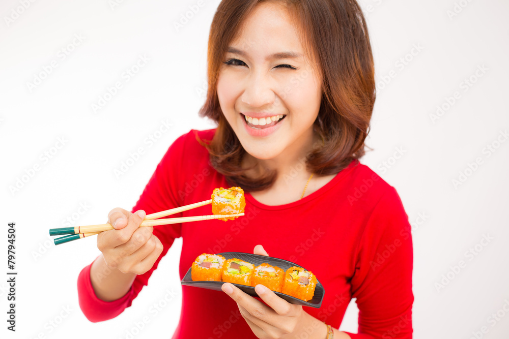 Close-up. young lady eating sushi roll Close-up. young lady eating sushi roll
