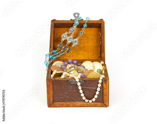 Open treasure chest with bracelets, coins, rings and pearls