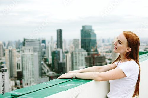 beautiful woman outdoors on the roof top photo