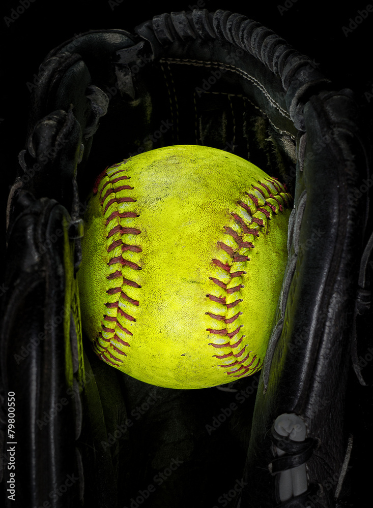 Old softball in a glove Stock Photo Adobe Stock
