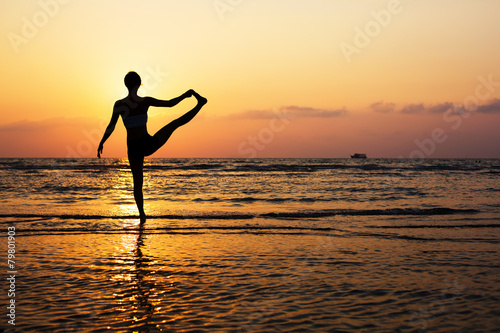 Yoga silhouette on the beach