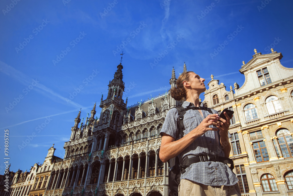 Obraz premium Man travel in Europe use map on navigator gps