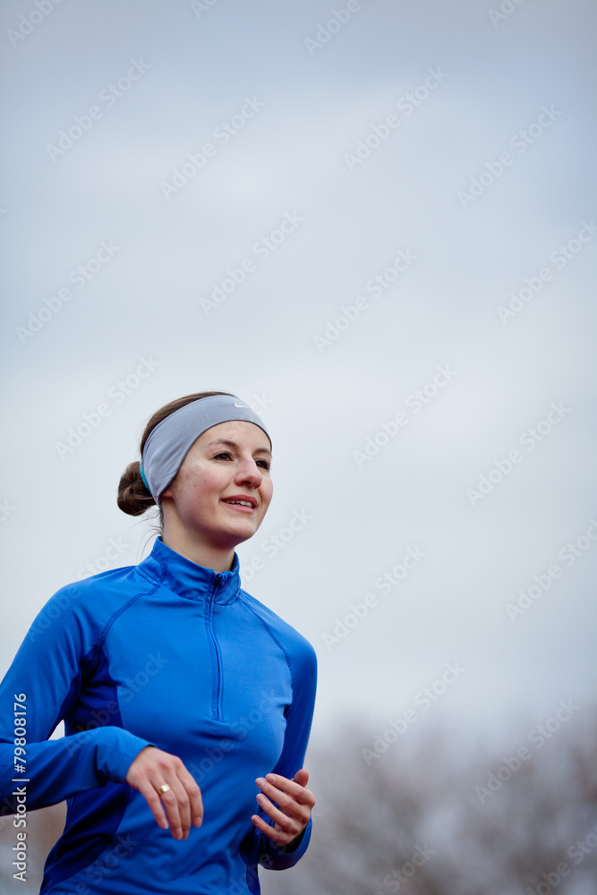 Portrait of a woman running against against blue sky Portrait of a woman running against against blue sky