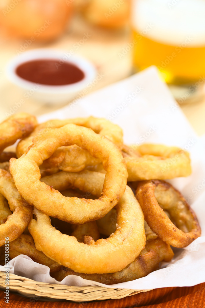 Homemade beer-battered onion rings in a basket