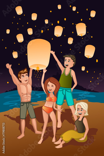 Young people releasing paper lanterns