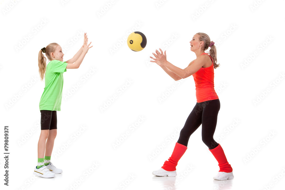 Little girl doing exercise with an instructor