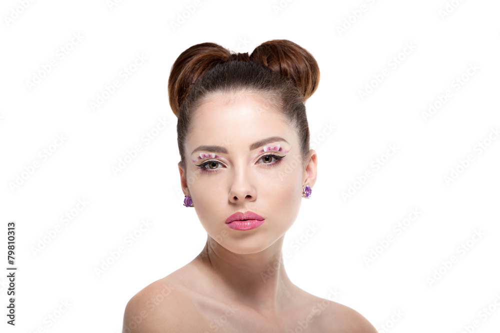 Young beautiful woman with perfect makeup, drawing bows Young beautiful woman with perfect makeup, drawing bows