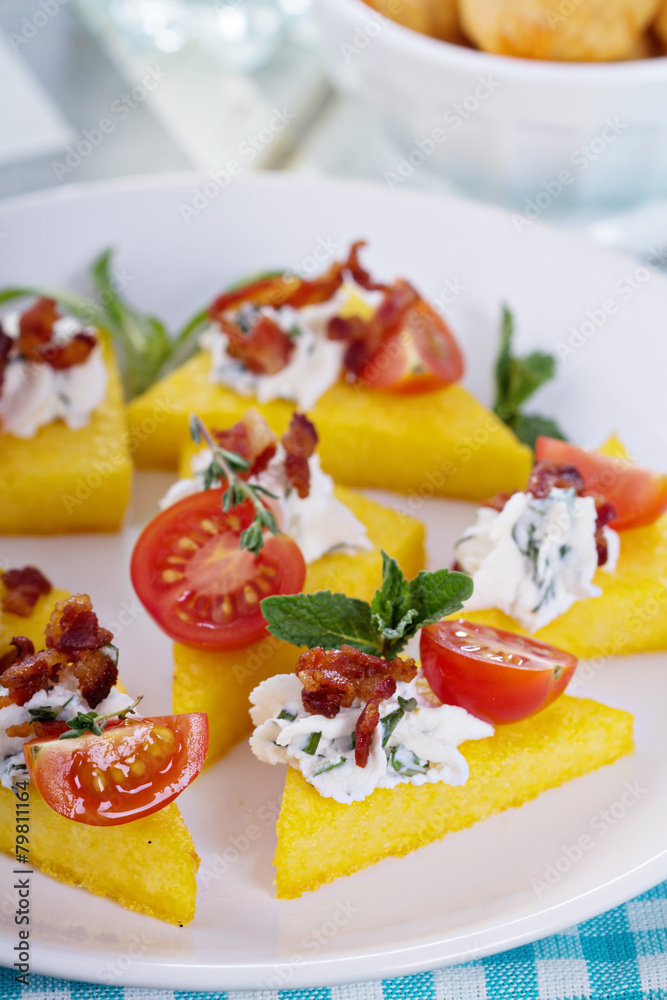 Polenta appetizers with ricotta and bacon
