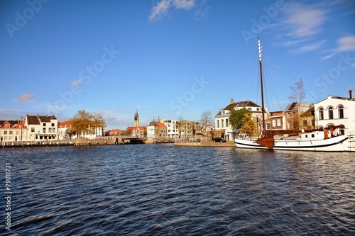 Cityscape of Delft with canal and historic houses