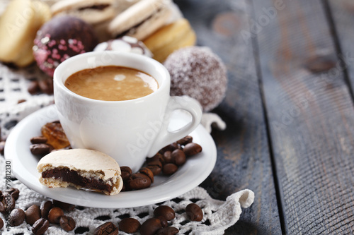 Gentle colorful macaroons and coffee in mug