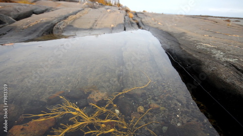 Rocky bath in  sea after low tide photo