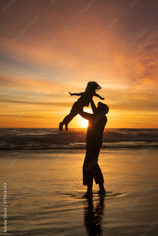 Girl enjoy holiday with father at beach