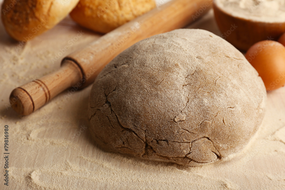 Fototapeta premium Making bread on wooden table background