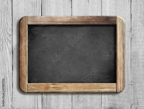 old chalkboard or blackboard on white wood
