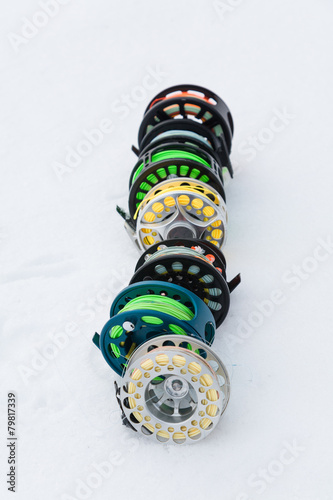 Fishing reels set close up isolated on white snow