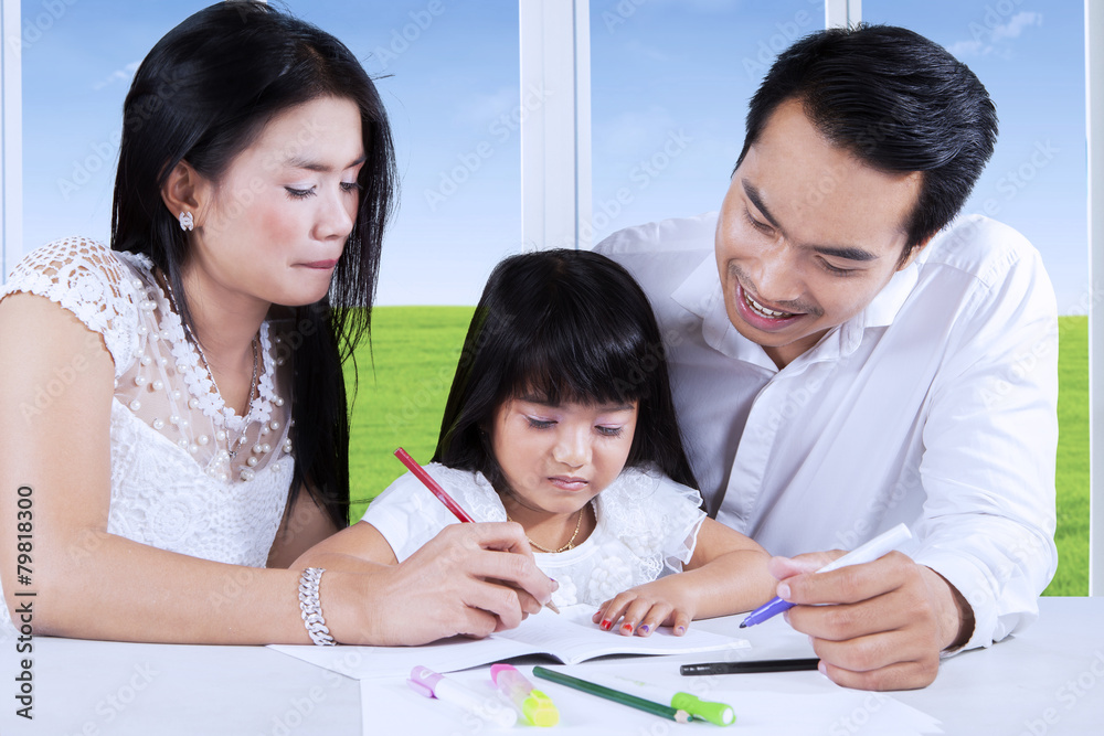 Parents help their child to write Parents help their child to write