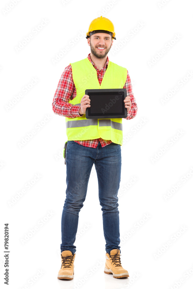 Smiling manual worker holding shockproof digital tablet Smiling manual worker holding shockproof digital tablet