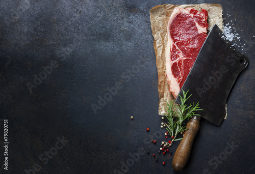 vintage cleaver and raw beef steak