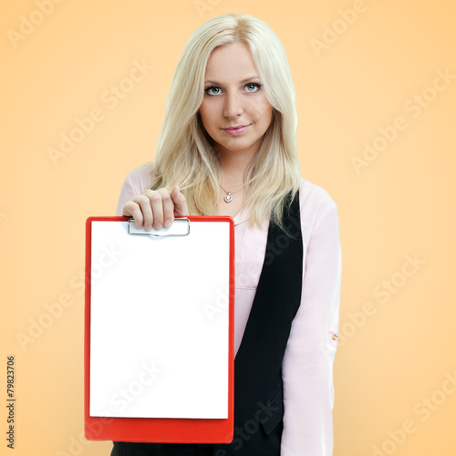 Successful businesswoman holding a clipboard with blank paper on