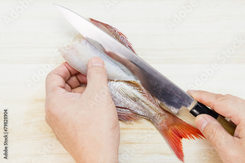 Preparing Tai sashimi  fillet a sea bream into three pieces 