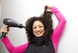 Latin woman drying her hair