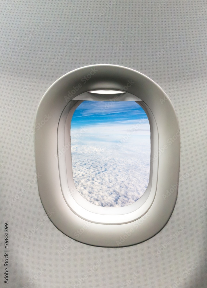 Fototapeta premium Looking out the window of a plane