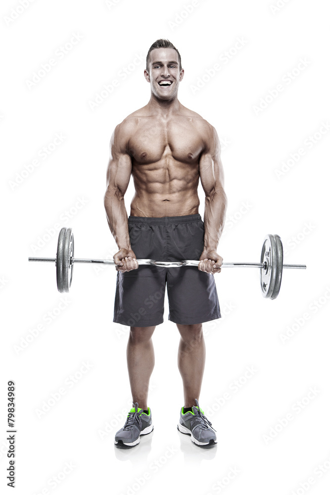 Muscular bodybuilder guy doing exercises with dumbbells over whi