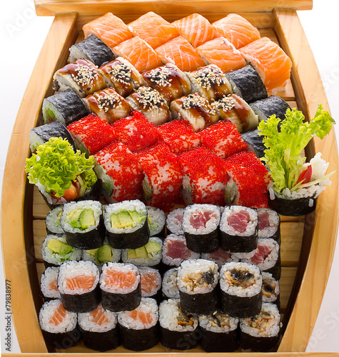 Sushi set in the wooden ship.