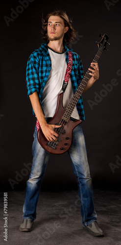 Bass guitarist. © indigolotos