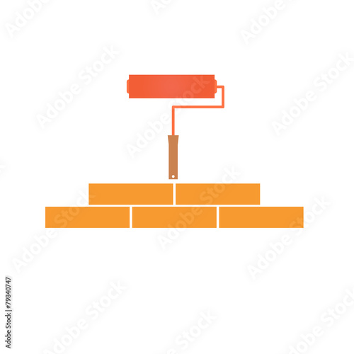 Paint roller and bricklaying. Concept of construction.