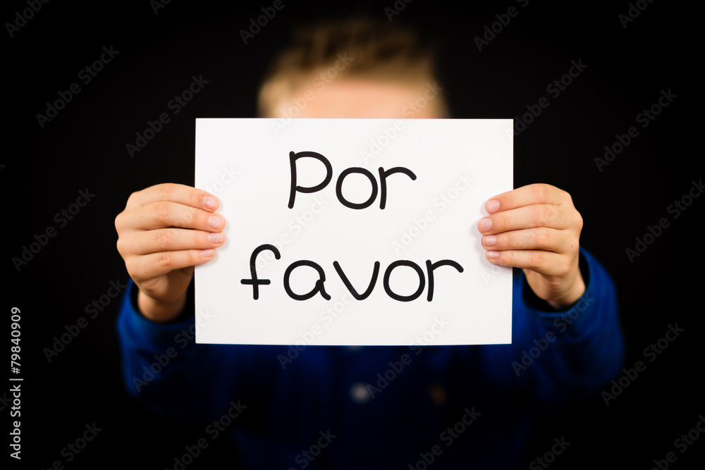 Child holding sign with Spanish words Por Favor - Please Child holding sign with Spanish words Por Favor - Please