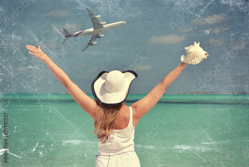 Scrated film effects. Girl at the ocean. Great Exuma, Bahamas photo