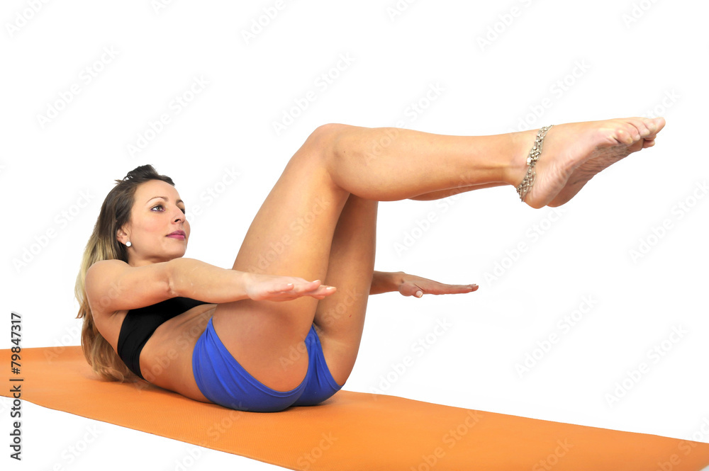 young sexy woman at gym doing yoga exercise and stretching young sexy woman at gym doing yoga exercise and stretching