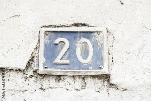 Number twenty on the wall of a house photo